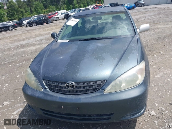 2003 Toyota Camry LE with VIN 4T1BE32K23U785060, listed as a IAAI auction lot 41825336 with 205,751 mi miles and . Bid and sale history available at DreamBid. Image 6.