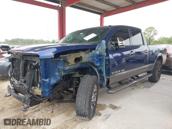2016 Nissan Titan Platinum Reserve z VIN 1N6BA1F20GN509360, wystawiony jako IAAI lot #41921670 z przebiegiem 164 784 mil mil oraz . Historia ofert i sprzedaży dostępna na DreamBid. Obrazek 2.