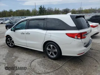 2020 Honda Odyssey Touring with VIN 5FNRL6H8XLB019365, listed as a Copart auction lot 52404335 with 59,486 mi miles and Salvage Title. Bid and sale history available at DreamBid. Image 2.