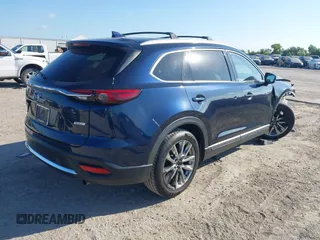 2016 Mazda CX-9 Grand Touring with VIN JM3TCADY6G0107064, listed as a IAAI auction lot 42580485 with 124,713 mi miles and . Bid and sale history available at DreamBid. Image 4.