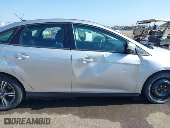 2012 Ford Focus SE z VIN 1FAHP3F28CL215997, wystawiony jako IAAI lot #42483639 z przebiegiem 101 518 mil mil oraz . Historia ofert i sprzedaży dostępna na DreamBid. Obrazek 6.