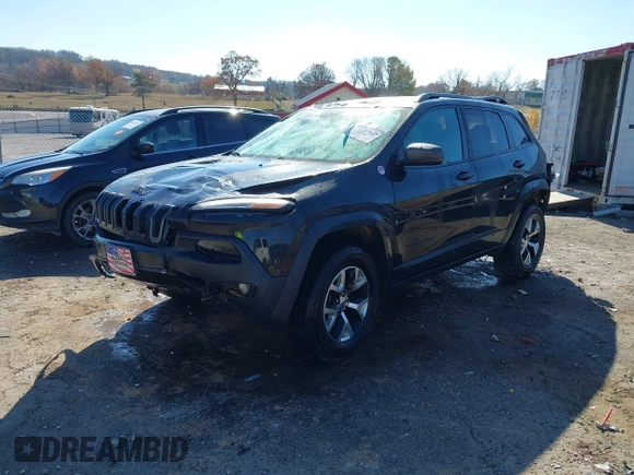 2015 Jeep Cherokee Trailhawk with VIN 1C4PJMBSXFW687737, listed as a IAAI auction lot 40963392 with 119,805 mi miles. Bid and sale history available at carsss.com. Image 2.