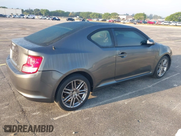 2012 Scion tC with VIN JTKJF5C74C3026945, listed as a IAAI auction lot 41757437 with 104,039 mi miles. Bid and sale history available at carsss.com. Image 4.