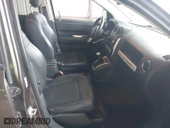 2016 Jeep Compass Latitude with VIN 1C4NJCEA2GD599833, listed as a IAAI auction lot 41507729 with 107,187 mi miles. Bid and sale history available at carsss.com. Image 5.