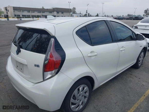 2015 Toyota Prius c One with VIN JTDKDTB3XF1097538, listed as a IAAI auction lot 42031057 with 100,847 mi miles. Bid and sale history available at carsss.com. Image 4.