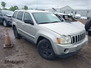 2007 Jeep Grand Cherokee Laredo z VIN 1J8GR48KX7C521617, wystawiony jako IAAI lot #42358540 z przebiegiem 162 466 mil mil oraz . Historia ofert i sprzedaży dostępna na DreamBid. Obrazek 1.