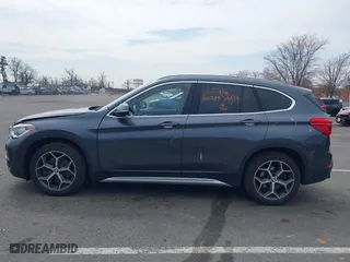 2019 BMW X1 xDrive28i with VIN WBXHT3C51K5L90571, listed as a IAAI auction lot 41909209 with 35,902 mi miles. Bid and sale history available at carsss.com. Image 14.
