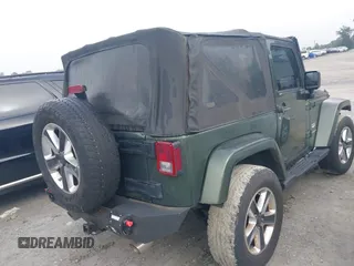 2008 Jeep Wrangler Sahara with VIN 1J4FA54118L653044, listed as a IAAI auction lot 42557244 with 152,072 mi miles and . Bid and sale history available at DreamBid. Image 4.