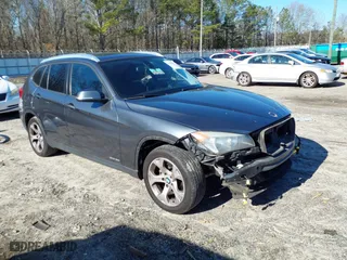 2014 BMW X1 sDrive28i with VIN WBAVM1C51EVW49093, listed as a IAAI auction lot 41500647 with 111,036 mi miles. Bid and sale history available at carsss.com. Image 1.