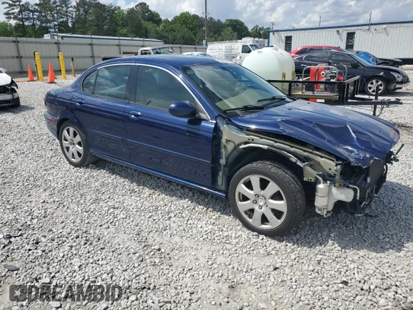 2004 Jaguar X-Type with VIN SAJEA51C44WD83361, listed as a Copart auction lot 55643545 with 54,615 mi miles and Salvage Title. Bid and sale history available at DreamBid. Image 4.