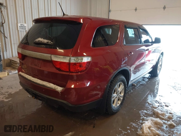 2013 Dodge Durango SXT with VIN 1C4RDJAG4DC527945, listed as a IAAI auction lot 41590545 with 141,074 mi miles and . Bid and sale history available at DreamBid. Image 4.
