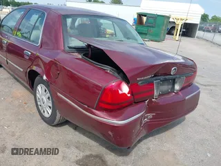 2005 Mercury Grand Marquis GS z VIN 2MEFM74W05X641274, wystawiony jako IAAI lot #42298098 z przebiegiem 159 424 mil mil oraz . Historia ofert i sprzedaży dostępna na DreamBid. Obrazek 6.