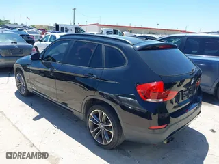 2014 BMW X1 sDrive28i with VIN WBAVM1C5XEVW51666, listed as a IAAI auction lot 42083936 with 176,465 mi miles. Bid and sale history available at carsss.com. Image 3.