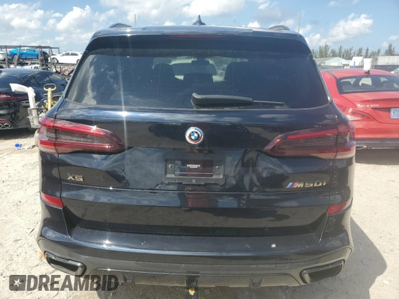 2023 BMW X5 M50i z VIN 5UXJU4C09P9P94657, wystawiony jako Copart lot #50709685 z przebiegiem Nie podano mil oraz Szkoda całkowita • Salvage title. Historia ofert i sprzedaży dostępna na DreamBid. Obrazek 6.