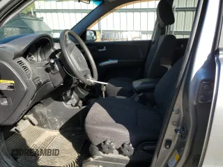 2007 Kia Sportage LX z VIN KNDJE723X77430674, wystawiony jako Copart lot #57050615 z przebiegiem 136 731 mil mil oraz Szkoda całkowita • Salvage title. Historia ofert i sprzedaży dostępna na DreamBid. Obrazek 7.