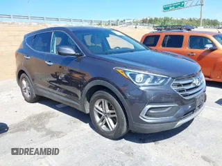 2018 Hyundai Santa Fe 2.4L z VIN 5XYZTDLB1JG568580, wystawiony jako IAAI lot #41861643 z przebiegiem 78 883 mil mil oraz . Historia ofert i sprzedaży dostępna na DreamBid. Obrazek 1.