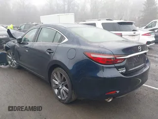 2021 Mazda 6 Touring with VIN JM1GL1VM4M1616243, listed as a IAAI auction lot 41907100 with 59,315 mi miles and . Bid and sale history available at carsss.com. Image 3.
