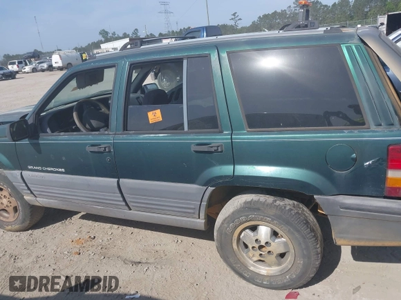 1996 Jeep Grand Cherokee Laredo with VIN 1J4FX58S9TC300710, listed as a IAAI auction lot 42073391 with 1 mi miles. Bid and sale history available at carsss.com. Image 14.