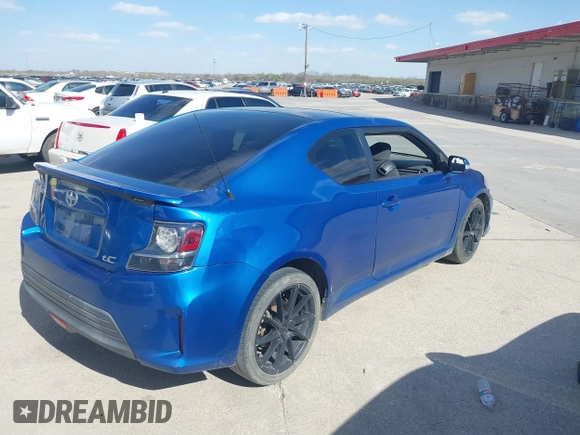 2015 Scion tC with VIN JTKJF5C77F3088828, listed as a IAAI auction lot 41846399 with 203,677 mi miles. Bid and sale history available at carsss.com. Image 4.