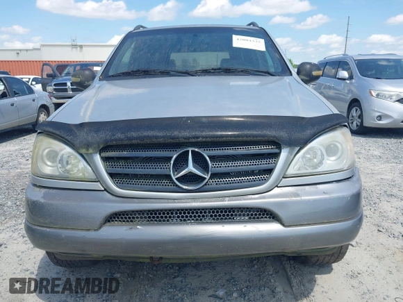 1998 Mercedes-Benz M-Class with VIN 4JGAB54E3WA031579, listed as a IAAI auction lot 42004335 with 156,898 mi miles. Bid and sale history available at carsss.com. Image 6.
