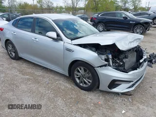 2019 Kia Optima LX z VIN 5XXGT4L35KG328583, wystawiony jako IAAI lot #42183952 z przebiegiem 108 429 mil mil oraz . Historia ofert i sprzedaży dostępna na DreamBid. Obrazek 1.