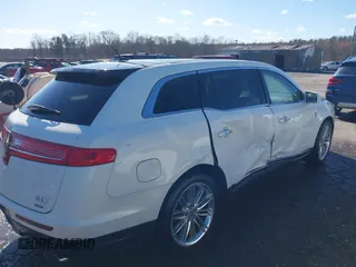 2013 Lincoln MKT EcoBoost with VIN 2LMHJ5AT8DBL55167, listed as a IAAI auction lot 41894396 with 121,114 mi miles. Bid and sale history available at carsss.com. Image 4.