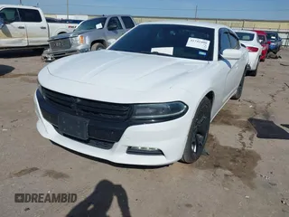 2015 Dodge Charger SXT with VIN 2C3CDXHG8FH725446, listed as a IAAI auction lot 41742400 with 84,579 mi miles and . Bid and sale history available at DreamBid. Image 2.