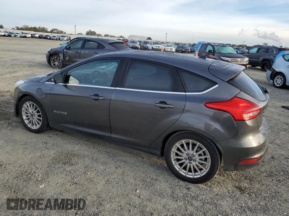 2015 Ford Focus Electric with VIN 1FADP3R43FL221870, listed as a Copart auction lot 79549284 with 67,079 mi miles and Salvage title. Bid and sale history available at DreamBid. Image 2.