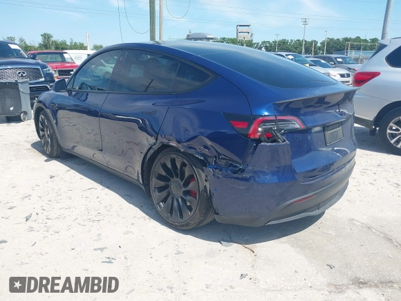 2023 Tesla Model Y Performance with VIN 7SAYGDEF9PF582908, listed as a IAAI auction lot 41930957 with 52,857 mi miles and . Bid and sale history available at DreamBid. Image 3.