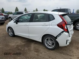 2016 Honda Fit LX with VIN JHMGK5H59GX004764, listed as a Copart auction lot 65131715 with 75,726 mi miles and Salvage title. Bid and sale history available at DreamBid. Image 2.