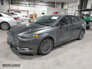 2018 Ford Fusion Hybrid Titanium with VIN 3FA6P0RU1JR117010, listed as a IAAI auction lot 41603439 with 124,151 mi miles. Bid and sale history available at carsss.com. Image 2.