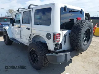 2017 Jeep Wrangler Unlimited Sahara with VIN 1C4BJWEG5HL588535, listed as a IAAI auction lot 42013571 with 70,012 mi miles. Bid and sale history available at carsss.com. Image 3.