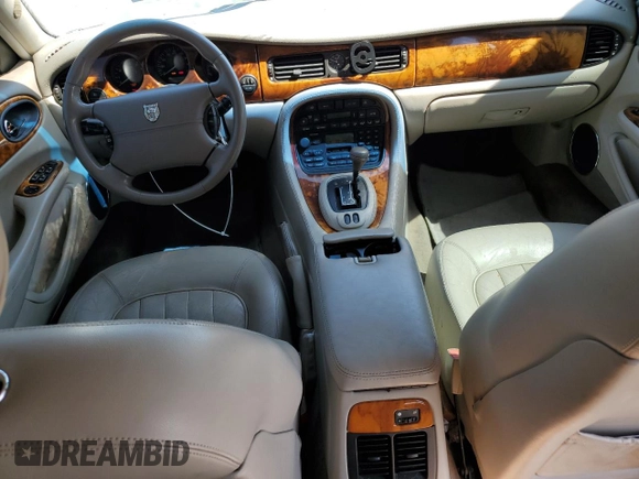 1999 Jaguar XJ with VIN SAJHX604XXC854217, listed as a Copart auction lot 56042735 with 127,092 mi miles and Salvage title. Bid and sale history available at DreamBid. Image 8.