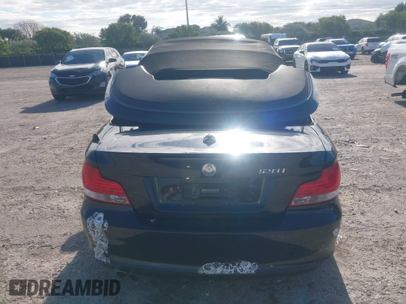 2011 BMW 1 Series 128i with VIN WBAUL7C54BVM80474, listed as a IAAI auction lot 42031032 with 76,617 mi miles and . Bid and sale history available at carsss.com. Image 16.