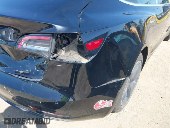 2018 Tesla Model 3 Long Range Battery with VIN 5YJ3E1EA7JF057031, listed as a IAAI auction lot 42139832 with 92,618 mi miles and . Bid and sale history available at DreamBid. Image 6.