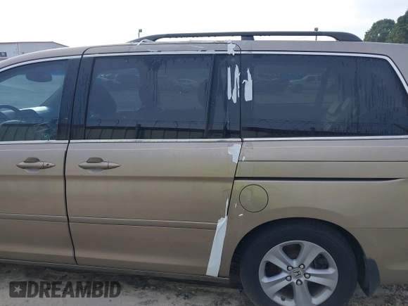 2010 Honda Odyssey Touring with VIN 5FNRL3H9XAB094779, listed as a IAAI auction lot 40412812 with 145,533 mi miles. Bid and sale history available at carsss.com. Image 6.
