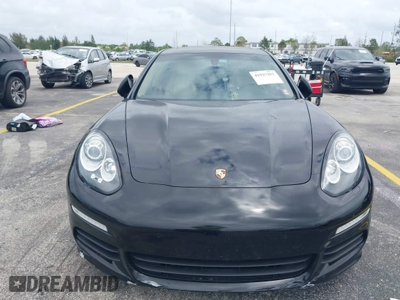 2015 Porsche Panamera S E-Hybrid z VIN WP0AD2A72FL040703, wystawiony jako IAAI lot #41937431 z przebiegiem 77 933 mil mil oraz . Historia ofert i sprzedaży dostępna na DreamBid. Obrazek 12.