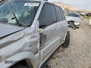 2004 Suzuki Grand Vitara LX z VIN JS3TD62V744104983, wystawiony jako Copart lot #65290274 z przebiegiem Nie podano mil oraz Szkoda całkowita • Salvage title. Historia ofert i sprzedaży dostępna na DreamBid. Obrazek 7.