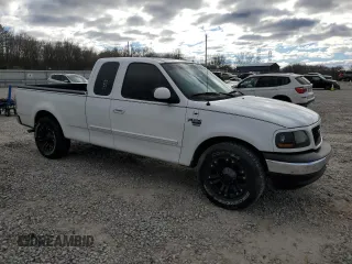 2002 Ford F-150 XL with VIN 1FTRX17W12NA96391, listed as a Copart auction lot 87000064 with 199,867 mi miles and Salvage Title. Bid and sale history available at carsss.com. Image 4.