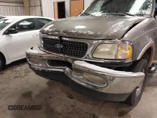 1999 Ford Expedition XLT z VIN 1FMPU18LXXLB47700, wystawiony jako IAAI lot #41592004 z przebiegiem Nie podano mil oraz . Historia ofert i sprzedaży dostępna na DreamBid. Obrazek 6.