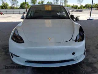 2024 Tesla Model Y с VIN 7SAYGDED5RF086456, выставлен на аукционе Copart как лот 57994835 с пробегом Не указан миль и Списание • Salvage title. История ставок и продаж доступна на DreamBid. Изображение 5.
