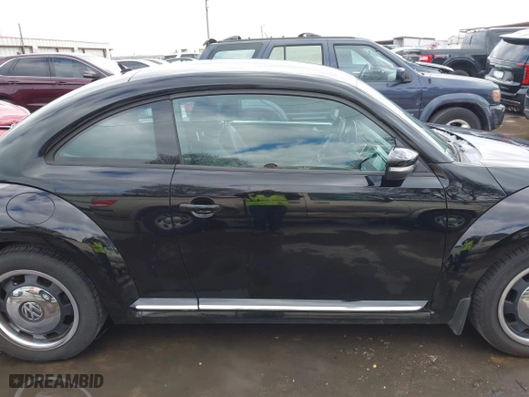 2012 Volkswagen Beetle 2.5L w/Sun/Sound/Nav PZEV with VIN 3VWHP7AT0CM623536, listed as a IAAI auction lot 41351333 with 106,600 mi miles. Bid and sale history available at carsss.com. Image 13.