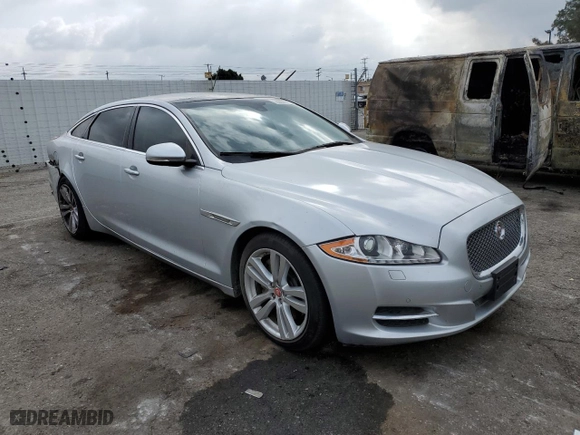 2014 Jaguar XJ with VIN SAJWJ2GD2E8V62696, listed as a Copart auction lot 76620494 with 85,487 mi miles and Salvage Title. Bid and sale history available at carsss.com. Image 4.