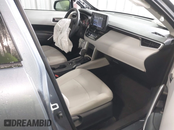 2022 Toyota Corolla Cross L with VIN 7MUAAAAG9NV034659, listed as a IAAI auction lot 42125356 with 14,631 mi miles and . Bid and sale history available at DreamBid. Image 5.
