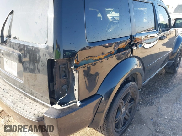 2007 Dodge Nitro SLT with VIN 1D8GT58K97W666680, listed as a IAAI auction lot 41573904 with 171,795 mi miles. Bid and sale history available at carsss.com. Image 12.