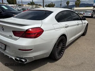 2015 BMW 6 Series 650i xDrive with VIN WBA6B4C57FD899926, listed as a Copart auction lot 54974505 with 63,570 mi miles and Salvage Title. Bid and sale history available at carsss.com. Image 4.