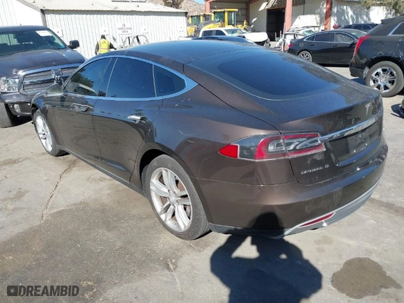 2013 Tesla Model S with VIN 5YJSA1DN4DFP19552, listed as a IAAI auction lot 41360466 with 129,806 mi miles. Bid and sale history available at carsss.com. Image 3.