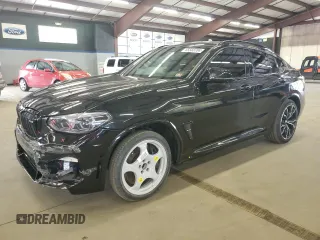 2020 BMW X4 M with VIN 5YMUJ0C06LLA99799, listed as a Copart auction lot 65583704 with 32,033 mi miles and Salvage Title. Bid and sale history available at carsss.com. Image 1.
