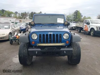 2010 Jeep Wrangler Unlimited Sport with VIN 1J4BA3H11AL144560, listed as a IAAI auction lot 42013032 with 226,233 mi miles. Bid and sale history available at carsss.com. Image 12.