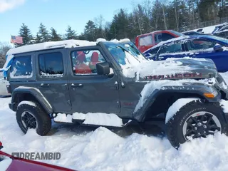 2020 Jeep Wrangler Unlimited Rubicon z VIN 1C4HJXFN5LW176104, wystawiony jako IAAI lot #41332511 z przebiegiem 70 428 mil mil oraz . Historia ofert i sprzedaży dostępna na DreamBid. Obrazek 14.